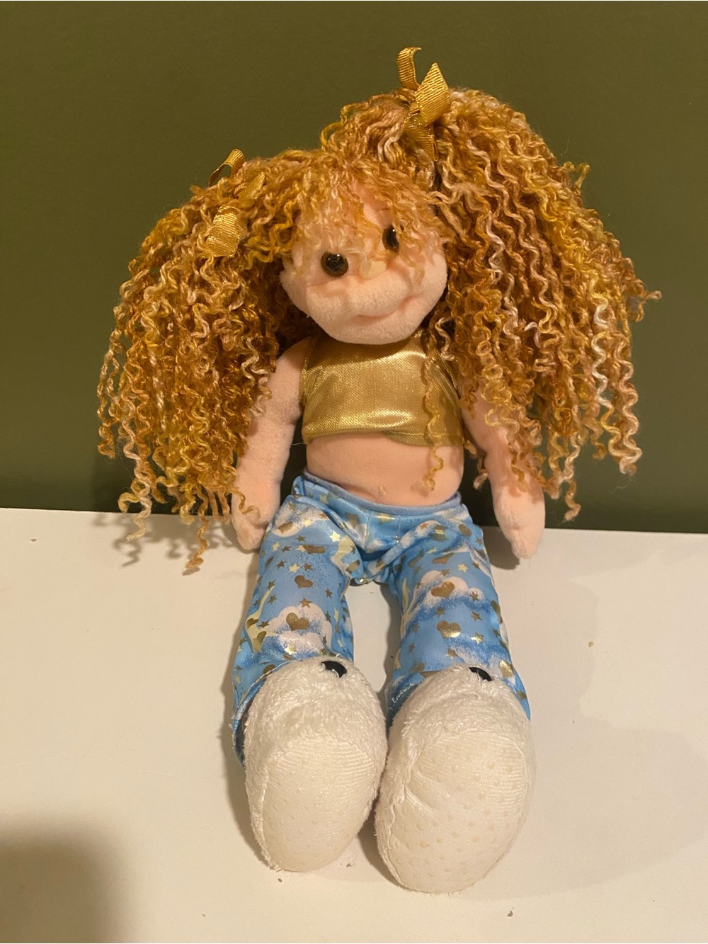Curly-Haired Plush Doll in Gold Top and Blue Star Pants